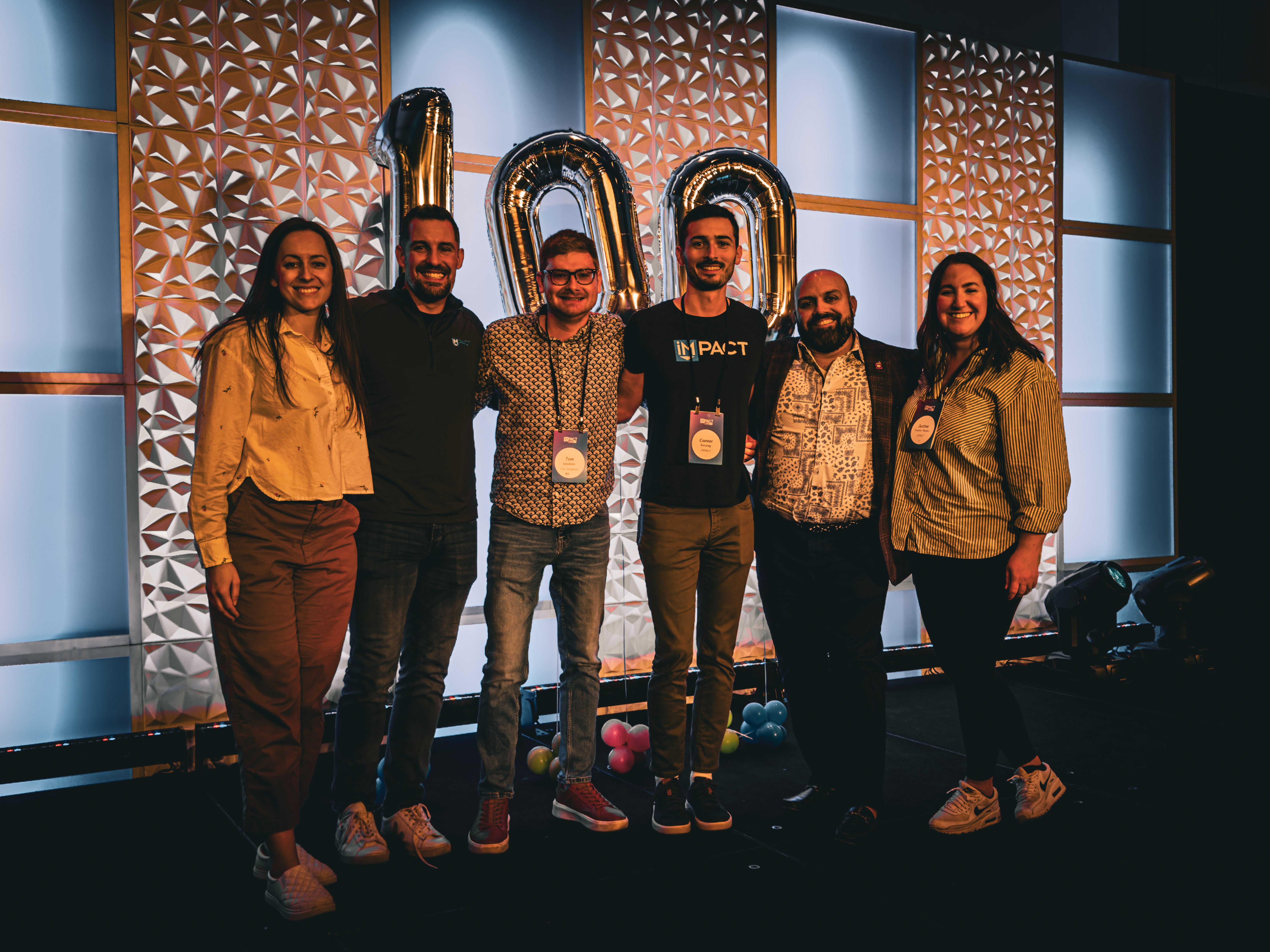 Tom with members of the IMPACT team